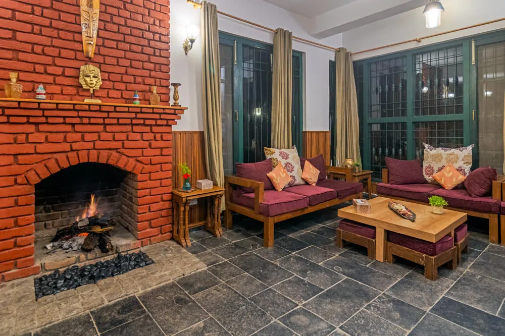 By the fireplace